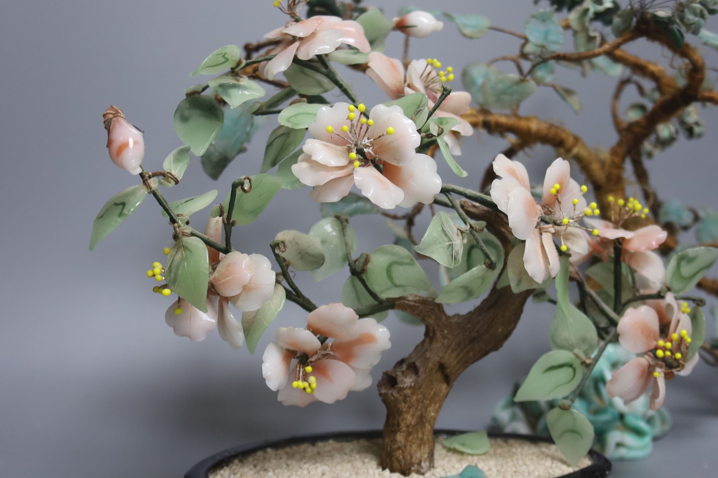 A pair of Chinese glass models of trees, tallest 29 cm